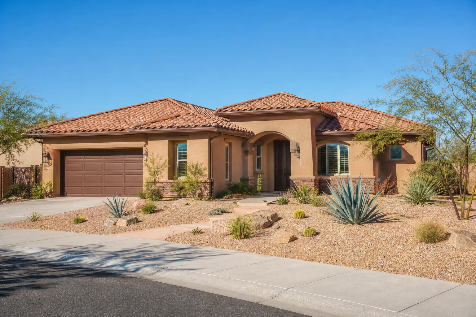 A clean tile roof and cleared gutters on a Phoenix-area home prepared for monsoon season