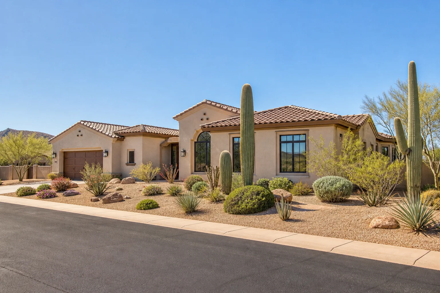 Arizona stucco home with tile roof and multiple large windows illustrating how to reduce heat gain through your windows in summer