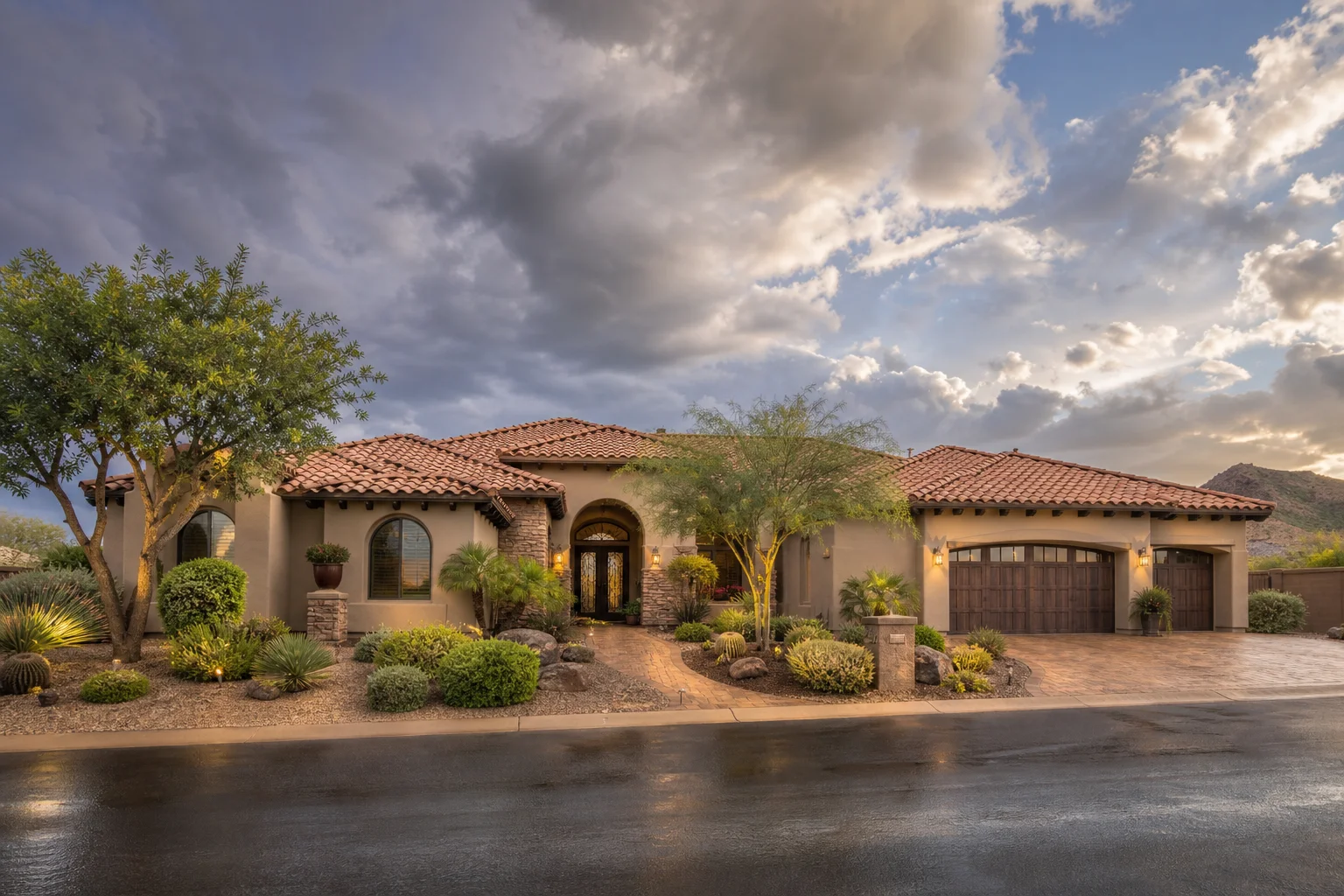 Arizona residential home with completed tile roof and desert landscaping after monsoon storm