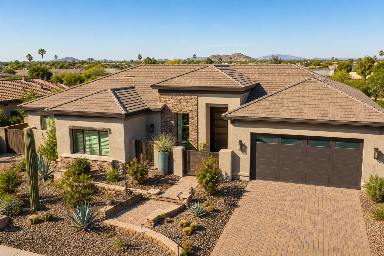 Wide view of a completed Arizona residential home exterior with a fully installed tile roof and desert landscaping in Mesa, AZ