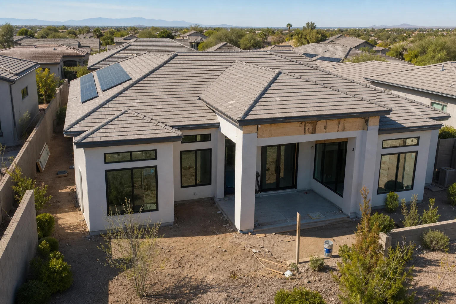 Finished Arizona home exterior with new custom windows and desert landscaping in warm afternoon light